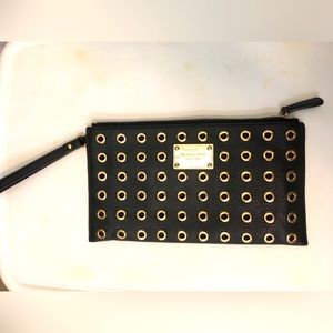 Michael Kors black leather clutch wristlet with gold grommets